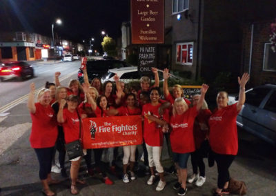 Meyer House Care Home stood outside the pub having finished their annual sponsored charity walk for The Fire Fighters Charity