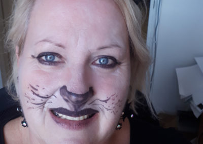 Meyer House staff member with Halloween cat make-up