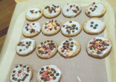 Meyer House residents iced and decorated biscuits with chocolate chips and candy stars