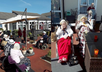 Meyer House Care Home residents enjoying live singing outside the Home in the sunshine