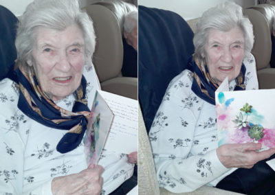 Meyer House Care Home resident Doris receiving card from her daughter