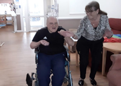 Meyer House Care Home resident Gill dancing with Bill