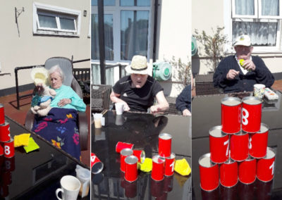 Meyer House Care Home residents playing table skittles outside in their garden