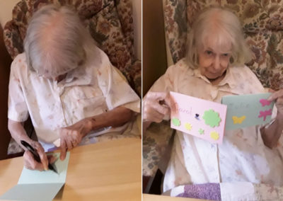 Meyer House Care Home resident with two cards she has made