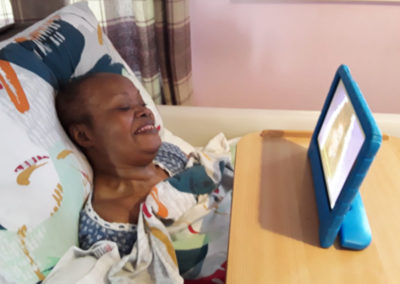 Meyer House Care Home resident watching a music video on an iPad