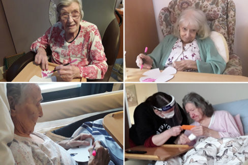 Meyer House residents making paper flowers for a display