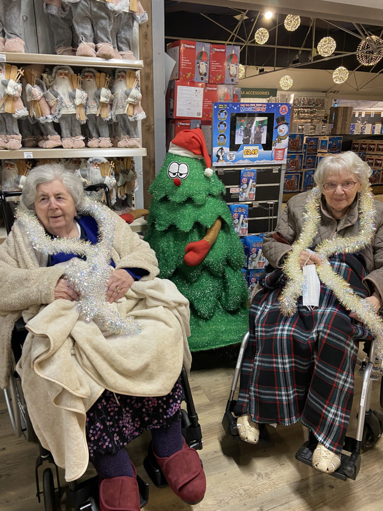 Meyer House Care Home residents enjoying the decorations and shop at a local Garden Centre