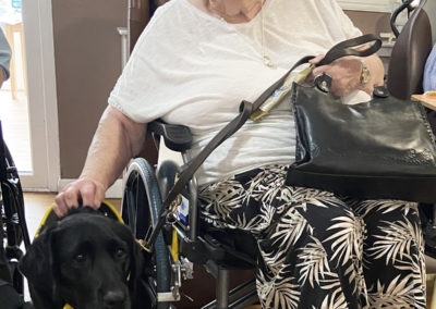 PAT dog Susie with lady resident at Meyer House Care Home