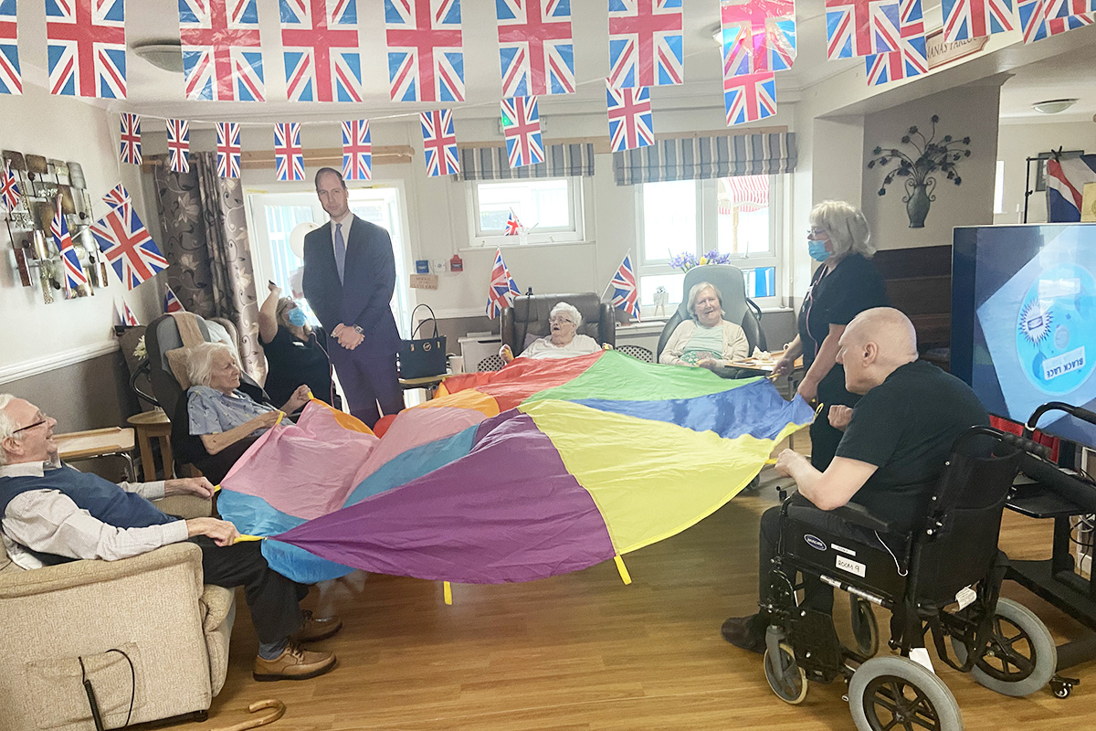 Meyer House Care Home residents enjoy parachute games to music