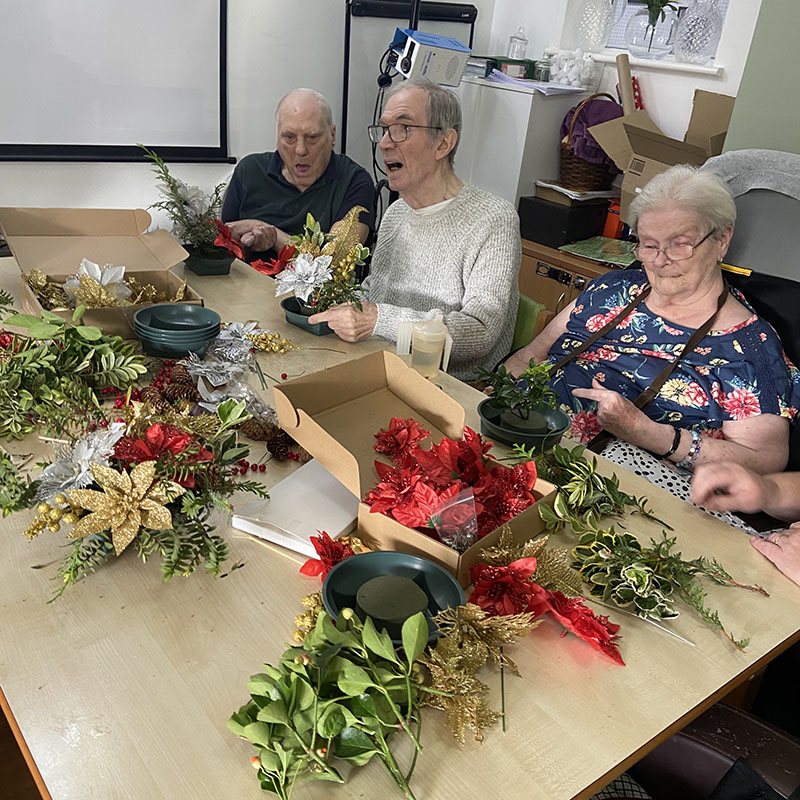 Making table decorations for Christmas at Meyer House Care Home